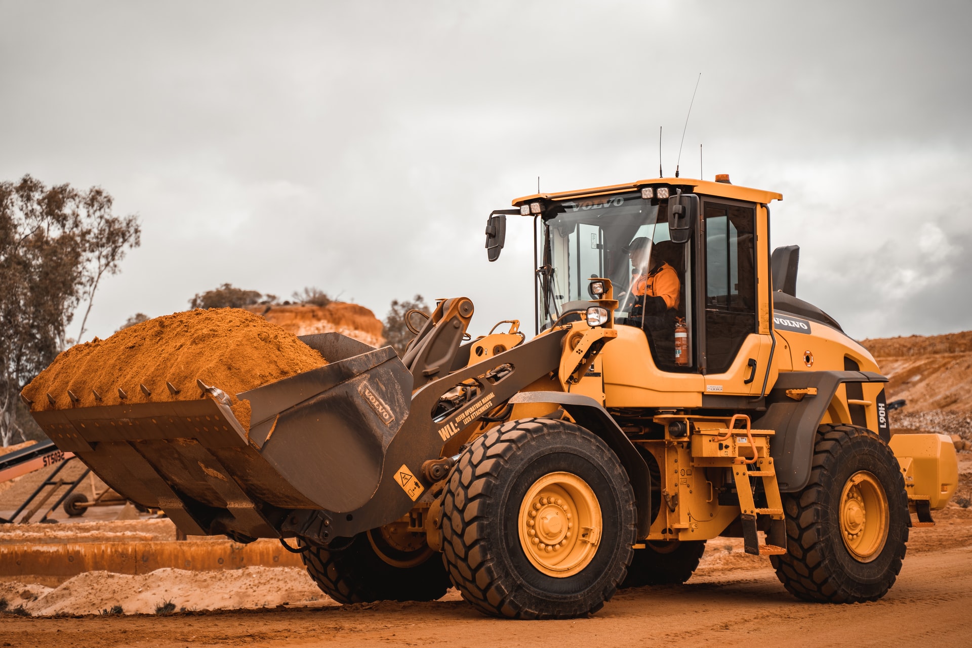 tractor carrying sand