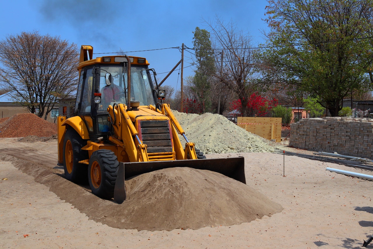 tractor gathering sand
